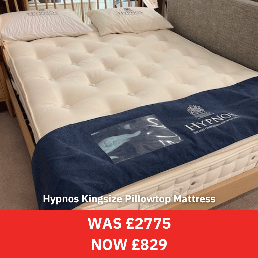 Hypnos kingsize pillowtop mattress on a bed with a price tag displayed.