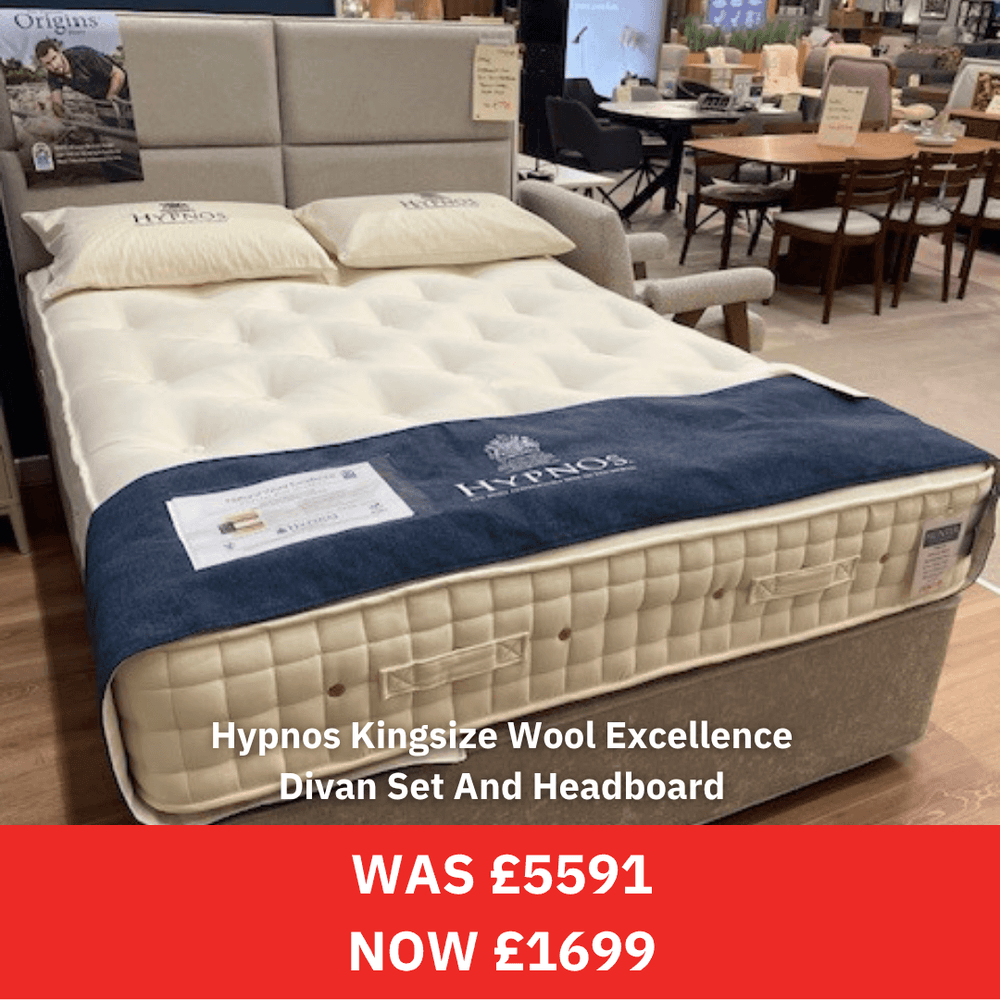 Hypnos Kingsize Wool Excellence Divan Set And Headboard in a showroom setting with price tag.