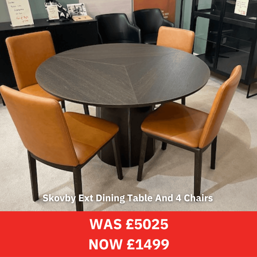 Round skovby set including dining table with four brown chairs in a showroom setting, with a price tag overlay.