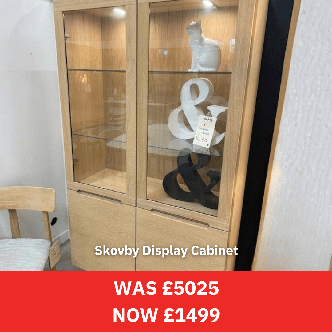 Skovby Display Cabinet with decorative items and price tag, on a white wall background.